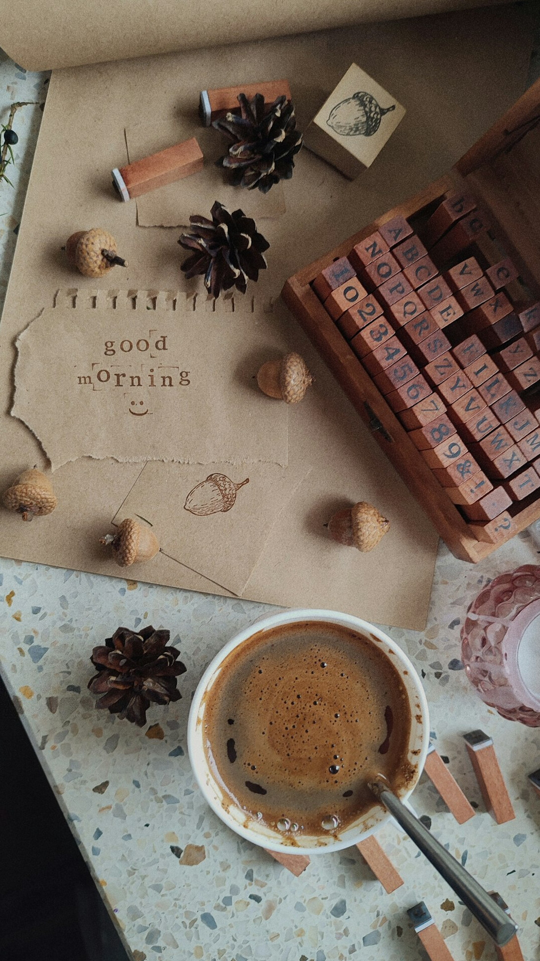 Wooden writing desk with typewriter, notebook and coffee cup